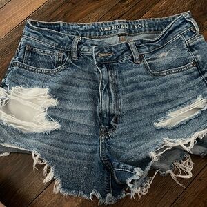 crossed denim shorts